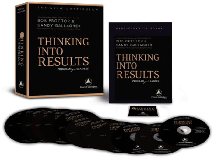 Two black boxes with gold letters saying Thinking into Results, twelve DVDs laid out in a row in front of the boxes